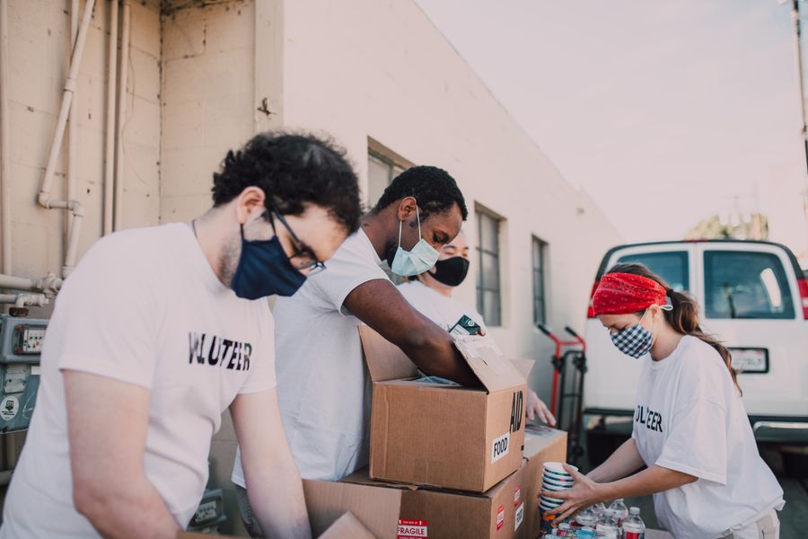 Volunteers working together to distribute essential supplies