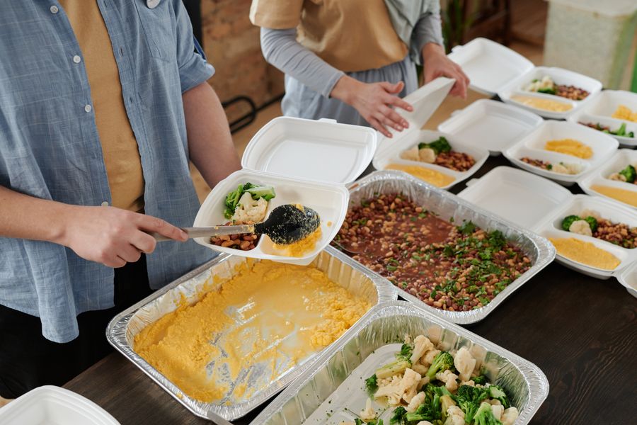 People preparing meal packs